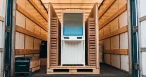 Image of a kiosk being shipped in the back of a freight truck.